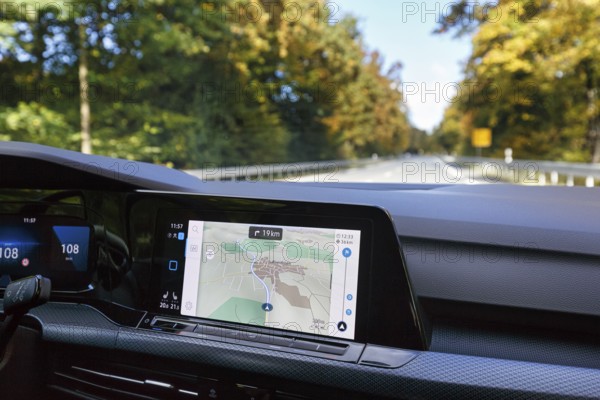 Interior of a Volkswagen, VW Golf 8, digital cockpit, central infotainment system with active navigation, touchscreen, driving across a country road, Barntrup, North Rhine-Westphalia, Germany