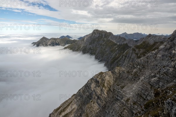 View from the Nebelhorn summit to mountains of the Allgäu Alps, mountains rising from fog in the valley, Oberstdorf, Oberallgäu, Allgäu, Bavaria, Germany