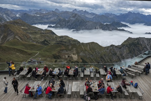 Restaurant at the Nebelhorn summit with views of the Allgäu Alps, mountains rising from fog in the valley, Oberstdorf, Oberallgäu, Allgäu, Bavaria, Germany