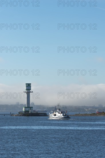 Green-white lighthouse Friedrichsort with city panorama of the state capital, Kiel Fjord, Kiel, haze bell, shipping, tower, architecture, landmark, orientation, navigation, shipping, blue sky, Schleswig-Holstein, Germany