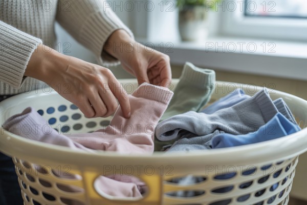 Woman's hands sorting socks in a laundry basket. Household chores and organization concept. Generative ai, AI generated