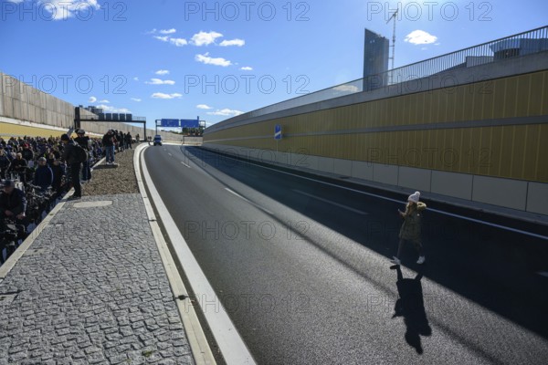 A young person is running on the blocked A100 during a demo on the 16th construction phase of the A100. Berlin, 18.10.2025