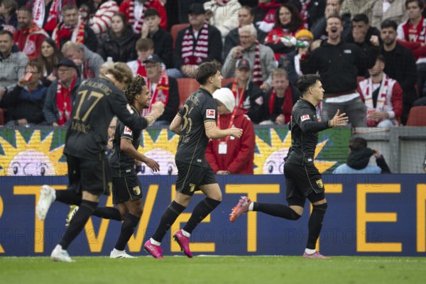 Kristijan Jakic (FC Augsburg, Midfield, #17), Mert Kömür (FC Augsburg, Midfield, #36), COLOGNE, Germany - OCTOBER 18: During the Bundesliga match between FC Cologne vs. FC Augsburg at Rheinenergie-Stadion on matchday 8 of the 1st Bundesliga on October 18, 2025 in Cologne, Germany. DFL REGULATIONS PROHIBIT ANY USE OF PHOTOGRAPHS AS IMAGE SEQUENCES AND/OR QUASI-VIDEO, Rheinenergie-Stadion, Cologne, North Rhine-Westphalia, Germany