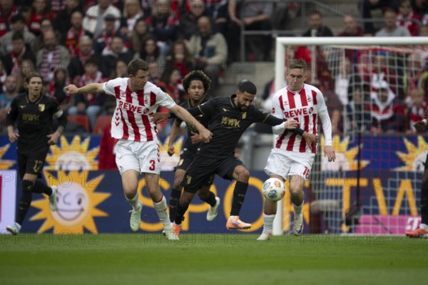 Dominique Heintz (1.FC Cologne, defense, #3), Chrislain Matsima (FC Augsburg, defense, #5), COLOGNE, Germany - OCTOBER 18: during the Bundesliga match between FC Cologne vs. FC Augsburg at Rheinenergie-Stadion on matchday 8 of the 1st Bundesliga on October 18, 2025 in Cologne, Germany. DFL REGULATIONS PROHIBIT ANY USE OF PHOTOGRAPHS AS IMAGE SEQUENCES AND/OR QUASI-VIDEO, Rheinenergie-Stadion, Cologne, North Rhine-Westphalia, Germany