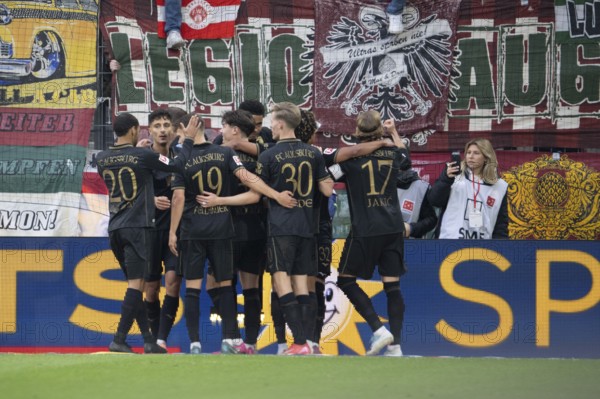 Alexis Claude-Maurice (FC Augsburg, midfield, #20), Anton Kade (FC Augsburg, midfield, #30), Kristijan Jakic (FC Augsburg, midfield, #17), COLOGNE, Germany - OCTOBER 18: During the Bundesliga match between FC Cologne vs. FC Augsburg at Rheinenergie-Stadion on matchday 8 of the 1st Bundesliga on October 18, 2025 in Cologne, Germany. DFL REGULATIONS PROHIBIT ANY USE OF PHOTOGRAPHS AS IMAGE SEQUENCES AND/OR QUASI-VIDEO, Rheinenergie-Stadion, Cologne, North Rhine-Westphalia, Germany