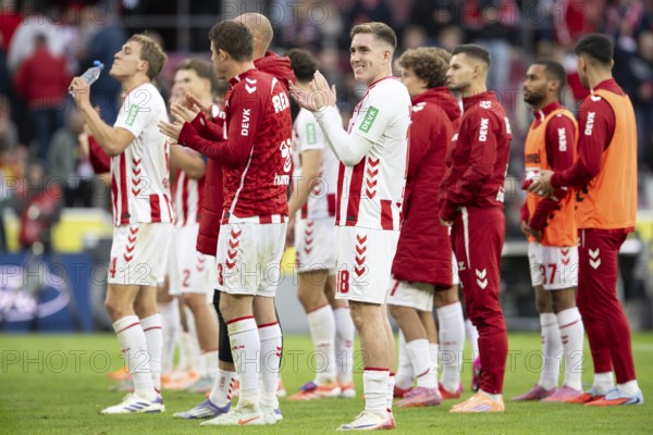 Dominique Heintz (1.FC Cologne, defense, #3), Isak Joannesson (1.FC Cologne, midfield, #18), Timo Hübers (1.FC Cologne, defense, #4), COLOGNE, Germany - OCTOBER 18: During the Bundesliga match between FC Cologne vs. FC Augsburg at Rheinenergie-Stadion on matchday 8 of the 1st Bundesliga on October 18, 2025 in Cologne, Germany. DFL REGULATIONS PROHIBIT ANY USE OF PHOTOGRAPHS AS IMAGE SEQUENCES AND/OR QUASI-VIDEO, Rheinenergie-Stadion, Cologne, North Rhine-Westphalia, Germany
