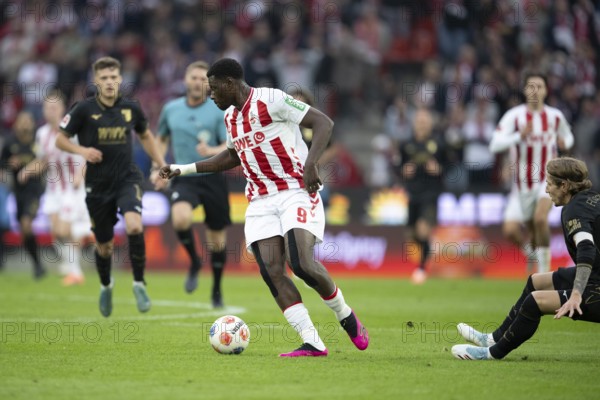 Ragnar Ache (1.FC Cologne, Storm, #9), COLOGNE, Germany - OCTOBER 18: During the Bundesliga match between FC Cologne vs. FC Augsburg at Rheinenergie-Stadion on matchday 8 of the 1. Bundesliga on October 18, 2025 in Cologne, Germany. DFL REGULATIONS PROHIBIT ANY USE OF PHOTOGRAPHS AS IMAGE SEQUENCES AND/OR QUASI-VIDEO, Rheinenergie-Stadion, Cologne, North Rhine-Westphalia, Germany