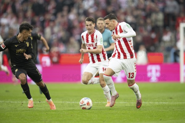 Jakub Kaminski (1.FC Cologne, midfield, #16), Said el Mala (1.FC Cologne, midfield, #13), COLOGNE, Germany - OCTOBER 18: during the Bundesliga match between FC Cologne vs. FC Augsburg at Rheinenergie-Stadion on matchday 8 of the 1st Bundesliga on October 18, 2025 in Cologne, Germany. DFL REGULATIONS PROHIBIT ANY USE OF PHOTOGRAPHS AS IMAGE SEQUENCES AND/OR QUASI-VIDEO, Rheinenergie-Stadion, Cologne, North Rhine-Westphalia, Germany