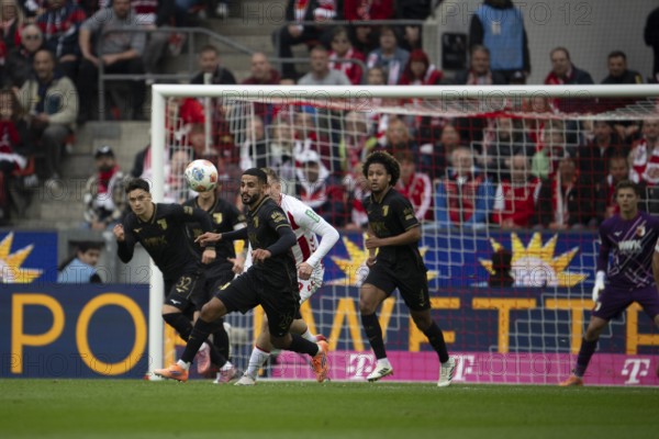 Fabian Rieder (FC Augsburg, midfield, #32), Chrislain Matsima (FC Augsburg, defense, #5), COLOGNE, Germany - OCTOBER 18: During the Bundesliga match between FC Cologne vs. FC Augsburg at Rheinenergie-Stadion on matchday 8 of the 1st Bundesliga on October 18, 2025 in Cologne, Germany. DFL REGULATIONS PROHIBIT ANY USE OF PHOTOGRAPHS AS IMAGE SEQUENCES AND/OR QUASI-VIDEO, Rheinenergie-Stadion, Cologne, North Rhine-Westphalia, Germany