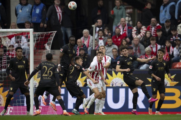 Eric Martel (1.FC Cologne, midfield, #6), Timo Hübers (1.FC Cologne, defense, #4), COLOGNE, Germany - OCTOBER 18: during the Bundesliga match between 1. FC Cologne vs. FC Augsburg at Rheinenergie-Stadion on matchday 8 of the 1. Bundesliga on October 18, 2025 in Cologne, Germany. DFL REGULATIONS PROHIBIT ANY USE OF PHOTOGRAPHS AS IMAGE SEQUENCES AND/OR QUASI-VIDEO, Rheinenergie-Stadion, Cologne, North Rhine-Westphalia, Germany