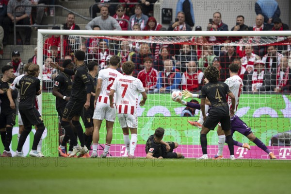 Joel Schmied (1.FC Cologne, defense, #2), Luca Wald-Schmidt (1.FC Cologne, Storm, #7), Finn Dahmen (FC Augsburg, goalkeeper, #1), COLOGNE, Germany - OCTOBER 18: During the Bundesliga match between FC Cologne vs. FC Augsburg at Rheinenergie-Stadion on matchday 8 of the 1st Bundesliga on October 18, 2025 in Cologne, Germany. DFL REGULATIONS PROHIBIT ANY USE OF PHOTOGRAPHS AS IMAGE SEQUENCES AND/OR QUASI-VIDEO, Rheinenergie-Stadion, Cologne, North Rhine-Westphalia, Germany