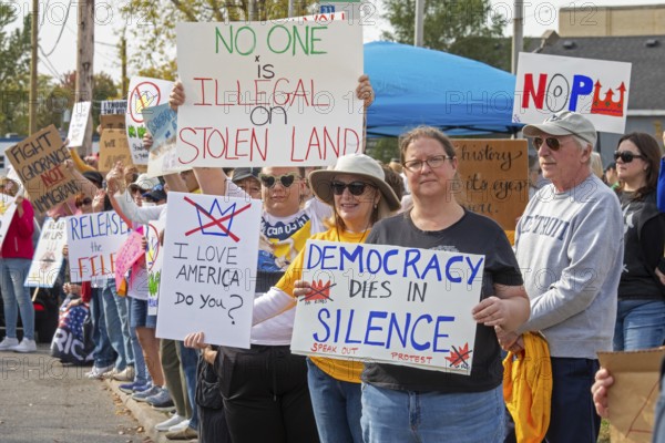 Detroit, Michigan USA - 18 October 2025 - Protesters from Detroit and Grosse Pointe gathered on the border between their cities for a 'No Kings' rally, protesting President Trump's actions against immigrants and against democratic institutions