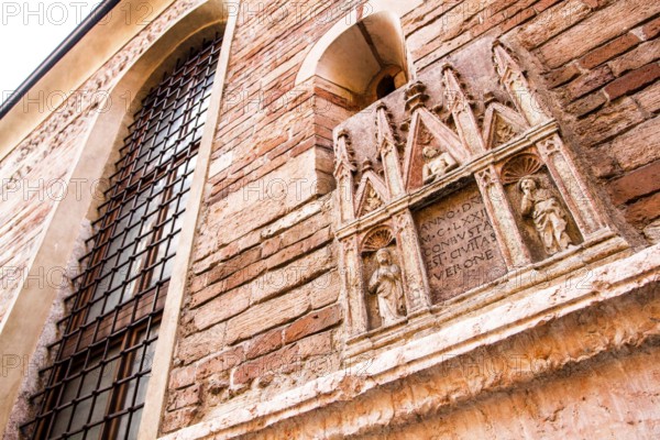 Medieval building facade in the historic center of Verona. Verona, Province of Verona, Italy. 10.12.2012