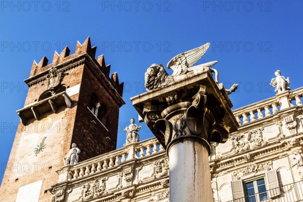 Column with the Lion of Saint Mark and Palazzo Maffei in the backgound at Piazza delle Erbe. Verona, Province of Verona, Italy