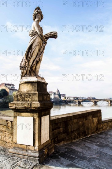 Detail of Ponte Santa Trinita (Holy Trinity Bridge), the oldest elliptic arch bridge in the world, and Ponte Alla Carraia in the background. Florence, Province of Florence, Italy