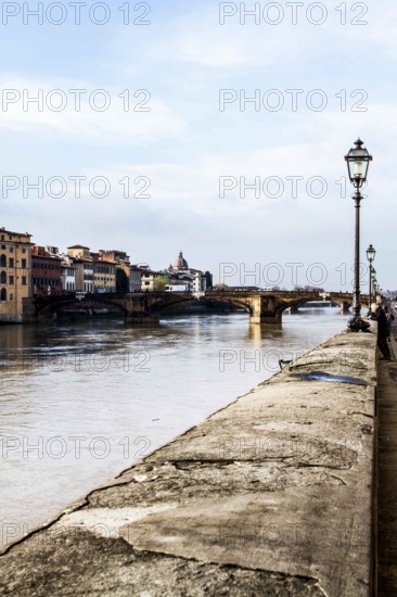Arno River and Ponte Santa Trinita (Holy Trinity Bridge) in the background. Florence, Province of Florence, Italy. 18.12.2012