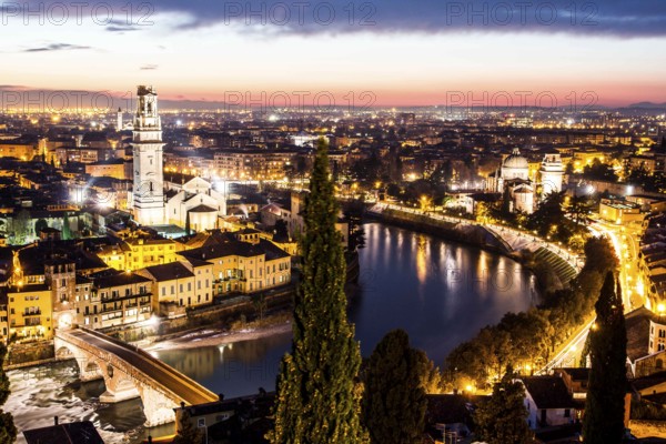 Verona Cathedral on the left, San Giorgio in Braida Church on the right, Ponte Pietra and view of the city at evening from Castel San Pietro. Verona, Province of Verona, Italy. 10.12.2012
