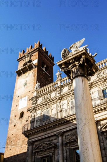 Column with the Lion of Saint Mark and Palazzo Maffei in the backgound at Piazza delle Erbe. Verona, Province of Verona, Italy. 10.12.2012