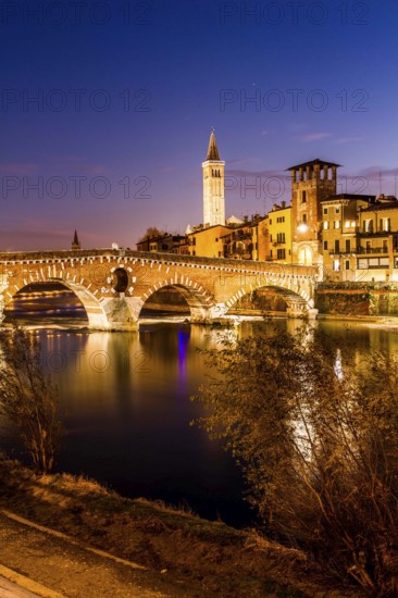 Ponte Pietra (Stone Bridge) over Adige River at evening, built by the Romans in 100 BC. Verona, Province of Verona, Italy. 09.12.2012