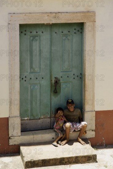 Seating boys in the Door, Alcântara, Maranhão, Brazil