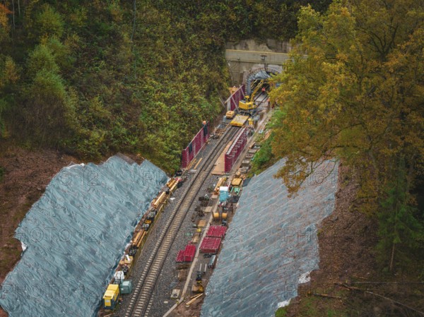Construction of a tunnel for a railway line in the midst of autumn nature, Herman-Hesse-Bahn construction site, Calw, Germany