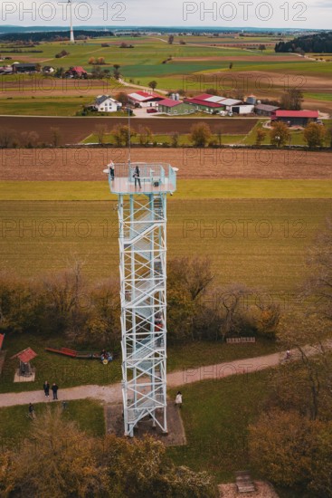 DefaultAn observation tower in the middle of a rural landscape with fields and buildings, surrounded by autumn colors, Dürrenmettstetten observation tower, Germany