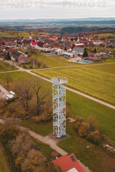 A tower offers a wide view of a village and surrounding fields in autumn colors, Dürrenmettstetten observation tower, Germany