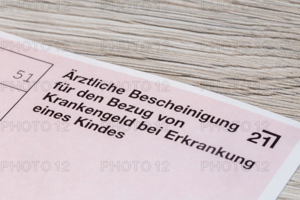Close-up of a medical certificate for receiving sickness benefit if the child is ill