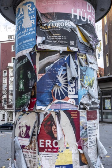 Advertising column for cultural projects, advertising for events, unkempt, torn and exfoliated posters, Essen, North Rhine-Westphalia, Germany