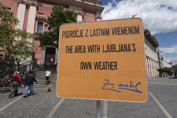 Sign on artificial rain system on Prešeren Square, Ljubljana, Slovenia