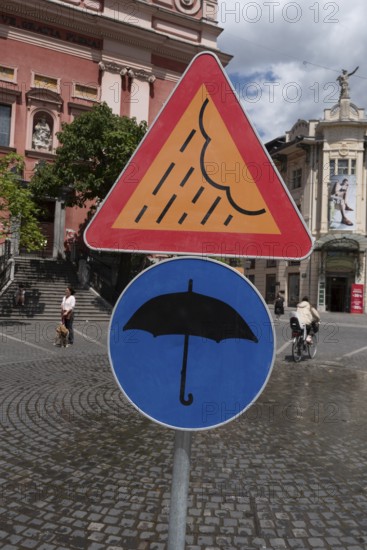 Signs on artificial rain system on Prešeren Square, umbrella, Ljubljana, Slovenia