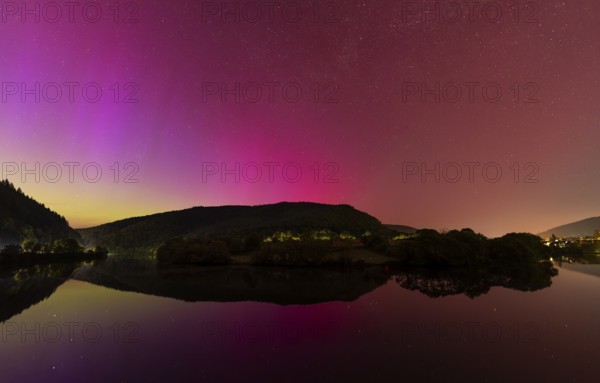 Nocturnal sky with aurora borealis. The Neckar river near Neckargemünd, Rhein-Neckar district, Baden-Württemberg, Germany