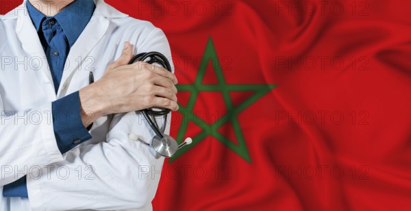 Morocco healthcare concept. Doctor with stethoscope on Morocco flag. Doctor holding stethoscope on Moroccan flag