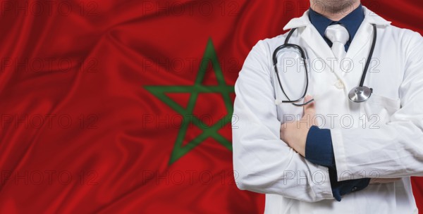 Male doctor with stethoscope on Morocco flag. Doctor holding stethoscope on Morocco flag