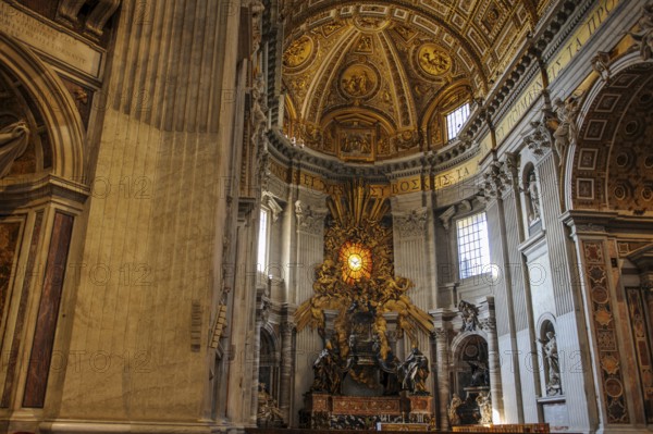 View of the main apse of St. Peter's Basilica with stylized larger-than-life bronze throne reliquary for wooden chair decorated with ivory plates Catheda Petri alleged chair of Simon Peter, Basilica of St. Peter, Vatican, Rome, Lazio, Italy