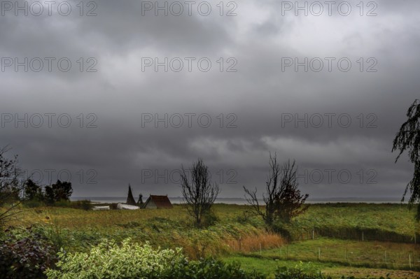 Dark rain clouds (Nimbostratus) over the lagoon, Ahrenshoop, Darß, Mecklenburg-Western Pomerania, Germany