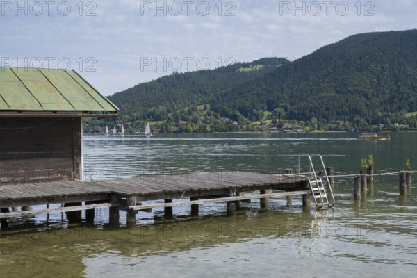 Hut and jetty on the banks of Tegernsee, Bad Wiessee, Upper Bavaria, Bavaria, Germany
