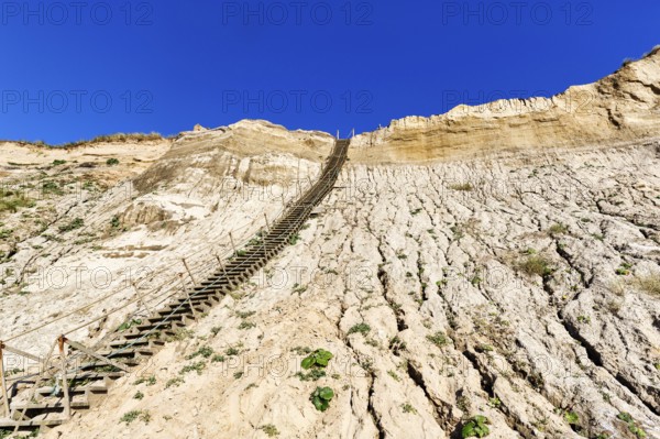 Extremely steep wooden staircase, steep coast down to the natural beach of the North Sea, demolition, erosion, tourist attraction, no. Lyngby, Lökken, Lönstrup, Jutland, Denmark