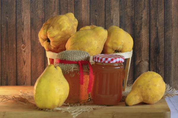 Picturesque still life with quinces and homemade quince jelly, autumn, Germany