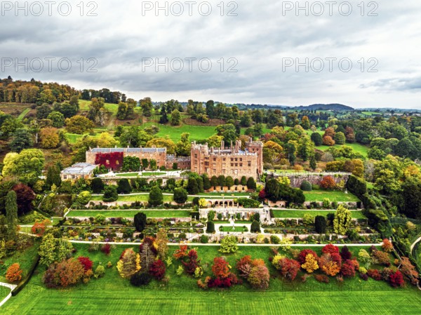 Autumn colours over Powis Castle and Garden from drone, Welshpool, Powys, Wales, England, United Kingdom