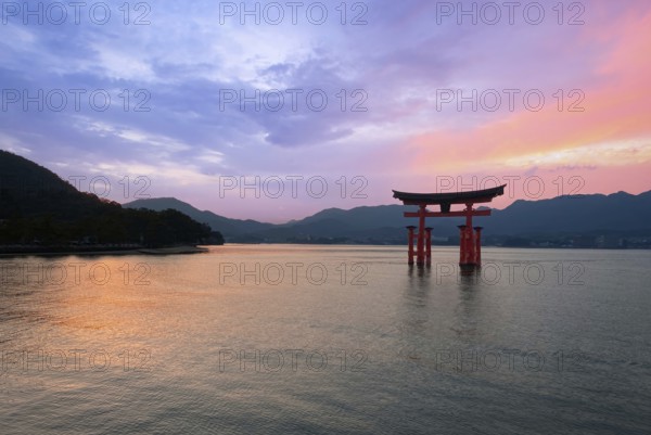 Japan, Miyajima, or Itsukushima, a semirural island with an iconic floating shrine with a giant red torii gate