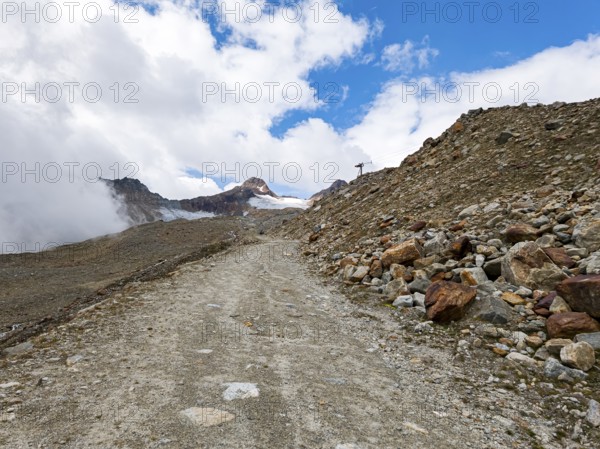 Mountain hiking trail in alpine mountain scenery in the area of the Tiefenbach Glacier near Sölden, Ötztal, Tyrol, Austria