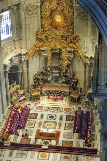 View from the dome of St. Peter's Basilica at Christian mass with meeting of ecclesiastical dignitaries in the main apse of St. Peter's Basilica in the western cross arm of the cathedral with Cathedra Petri symbolic Saint See in the Basilica of St. Peter, Vatican, Rome, Lazio, Italy in the apse of