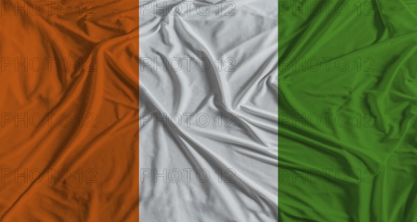 Ivorian flag with fabric texture background. National flag of Ivory Coast with cloth texture