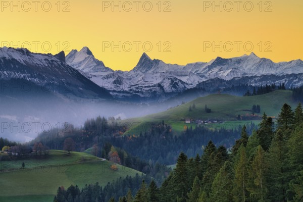 View of snow-covered Bernese Alps with Schreckhorn and Finsteraarhorn at dawn, Langnau im Emmental, Canton of Bern, Switzerland