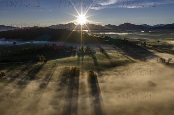 Mountains, sunny, morning light, autumn color, sun, back light, sun rays, fog, aerial view, view of Kochler Mountains, foothills of the Alps, Upper Bavaria, Bavaria, Germany