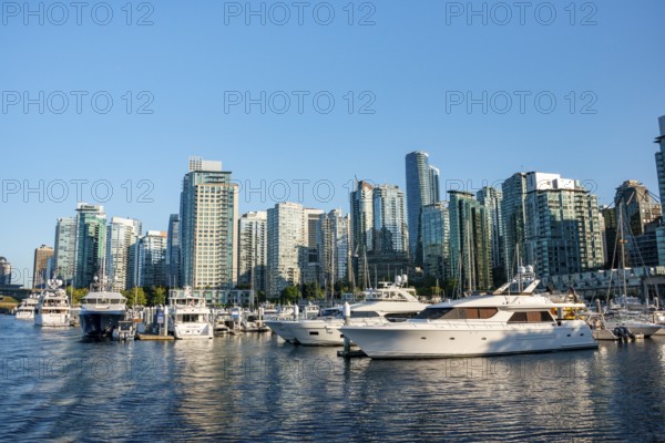 Sailing boats in marina, skyscrapers on the promenade, Coal Harbour, Vancouver, British Columbia, Canada