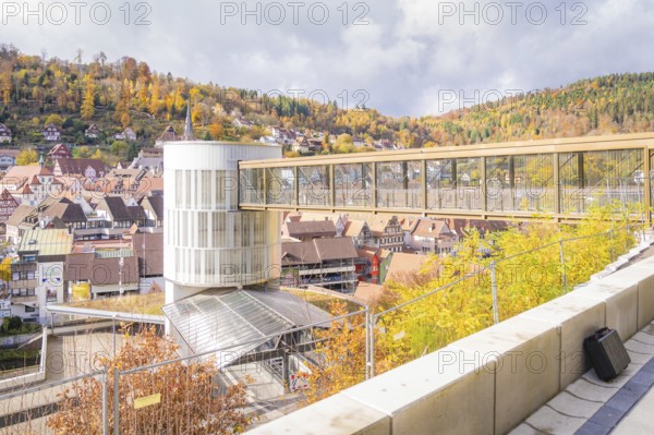 Bridge overlooking a town with autumn leaves and on a sunny day, ZOB Calw, Hermann Hessebahn, Calw, Germany