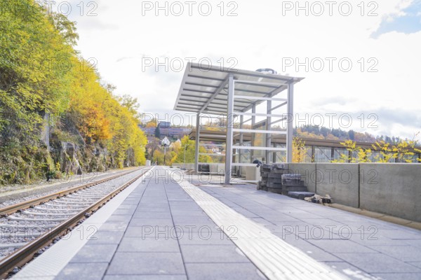 Empty train station with tracks and waiting room in autumn surroundings and modern design, ZOB Calw, Hermann Hessebahn, Calw, Germany