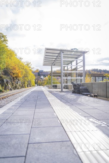 Empty train station in autumn surroundings with modern architecture and sunny weather, ZOB Calw, Hermann Hessebahn, Calw, Germany